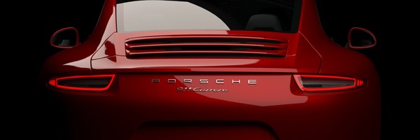 Rotes Auto von hinten, mit Porsche-Logo und Modellbezeichnung auf dem Kofferraum.